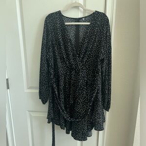 Black dress with white polka dots.